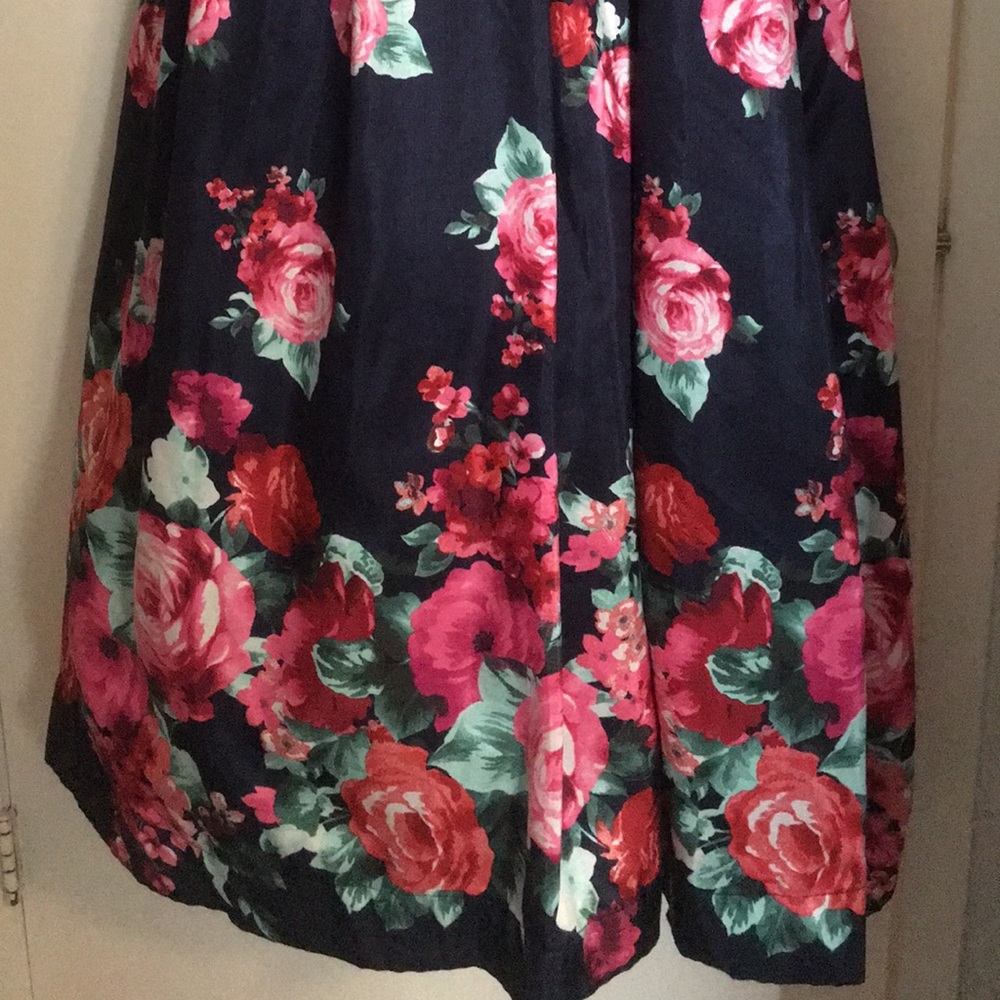 A Dillard’s floral navy blue PROM dress.